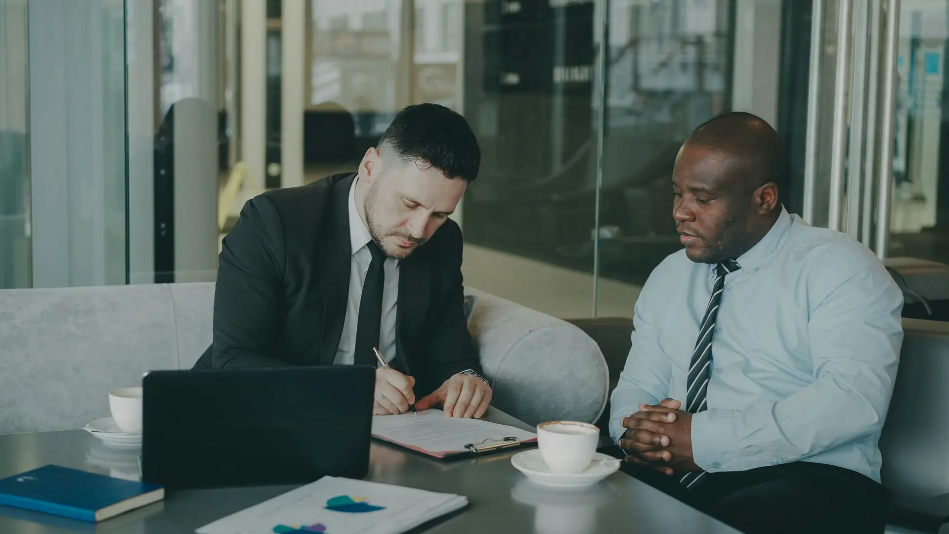 Business colleagues reviewing plans together